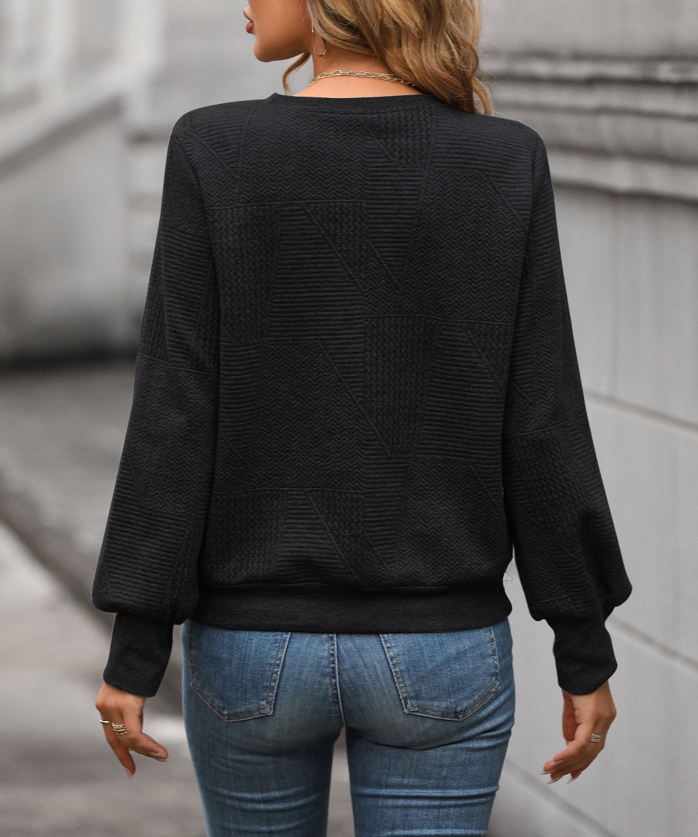 Pull col V à motifs géométriques pour femme